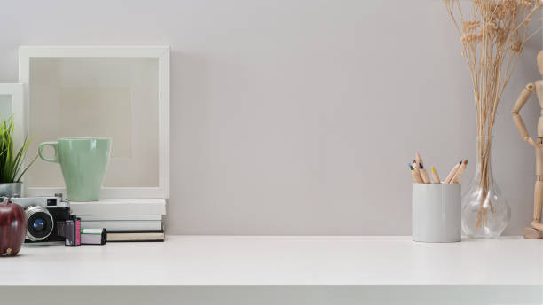 istock Contemporary workspace vintage camera, films, mockup poster and copy space 1097656860