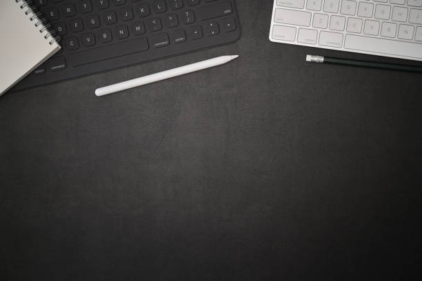 istock Office dark leather desk creative supplies workspace and copy space 1097656974