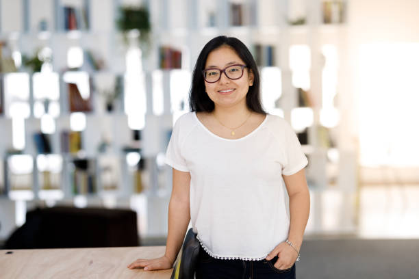 istock Confident woman standing in workplace 1097660222