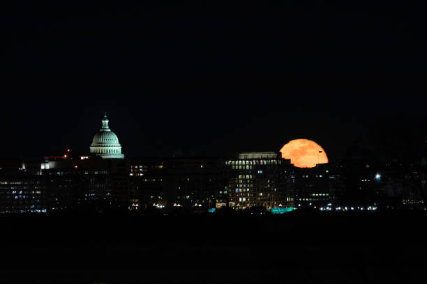View of full moon and the U.S. Capitol Building in DC January 21, 2019