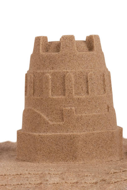 istock Close up on a sand castle on the beach, isolated on white background. 1097679990