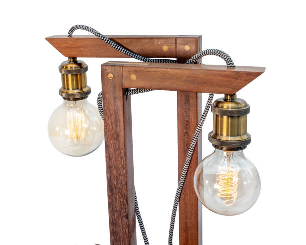 istock Rustic wood table lamp with small white lampshade isolated on white background 1097682390
