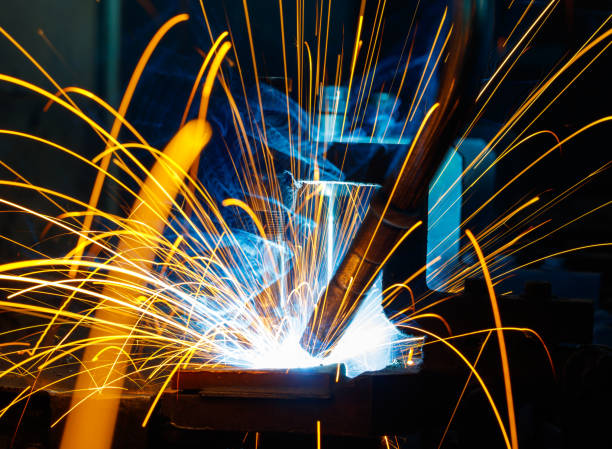 istock Welding robots movement in a car factory 1097686630