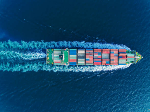 istock Aerial top view container ship full speed for logistics , import export, shipping or transportation. 1097687314