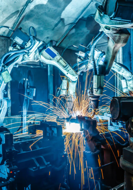 istock Robots welding in a car factory 1097688902