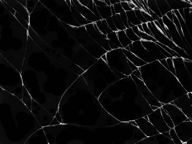 istock Cracked glass texture on black background 1097695508