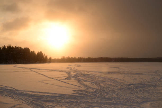 istock Frozen lake in the winter at sunset. 1097697342