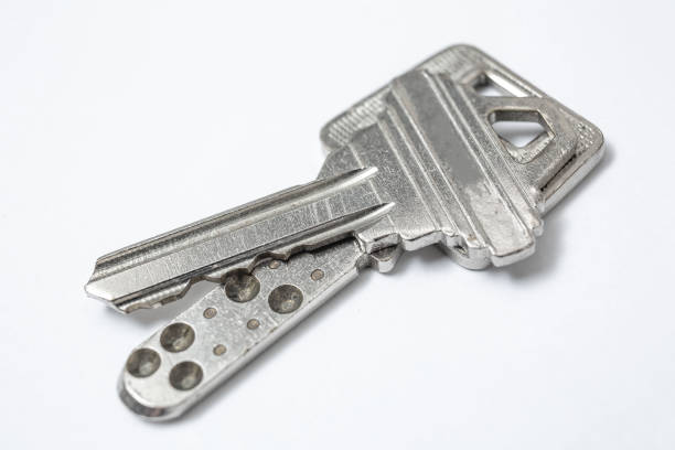 istock Close up of Silver key on white background 1097701574