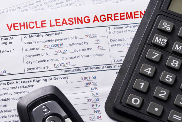 istock Automobile lease agreement document with key and pen on contract 1097704632