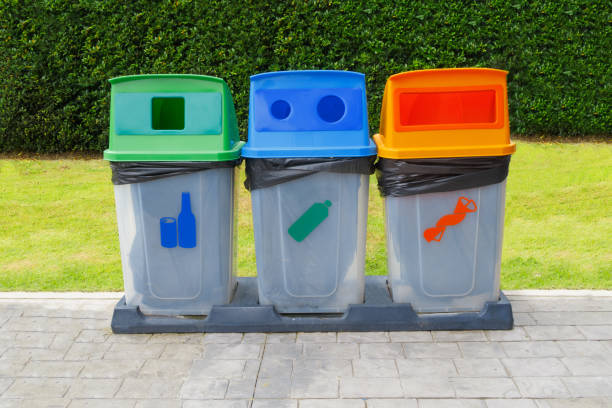 istock three plastic trash for separate type garbage on garden and community concept 1097706350