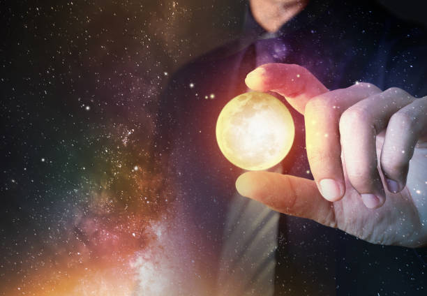 istock Businessman hold crystal clear ball model with universe galaxy background 1097707734
