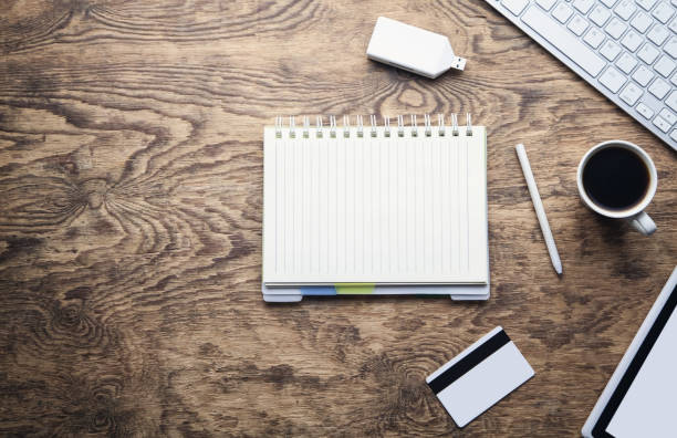istock Notepad computer keyboard and coffee on wooden desk. Business concept 1097710434