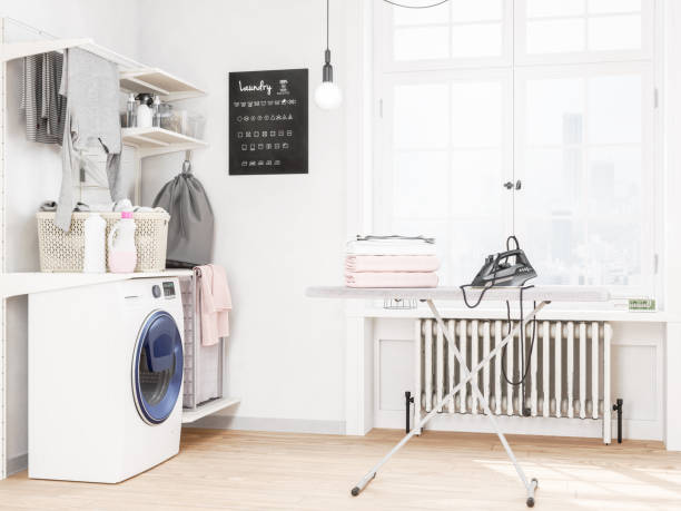 lavanderia con lavatrice e ferro da stiro - iron laundry cleaning ironing board foto e immagini stock