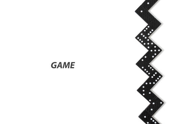 Black dominoes on white background with copy space