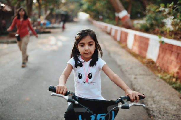 istock Preschool girl riding bicycle 1097720984