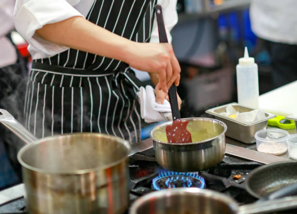 istock Chef cooking food in the kitchen, Chef preparing food 1097724734
