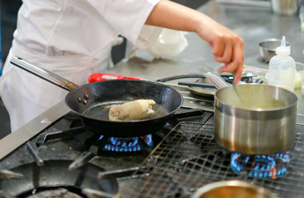 istock Chef cooking food in the kitchen, Chef preparing food 1097724746