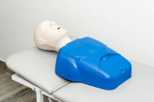 istock Hospital training dummy on hospital bed with mouth open. Medical first aid learning training mannequin. 1097725162
