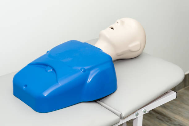 istock Hospital training dummy on hospital bed with mouth open. Medical first aid learning training mannequin. 1097725172