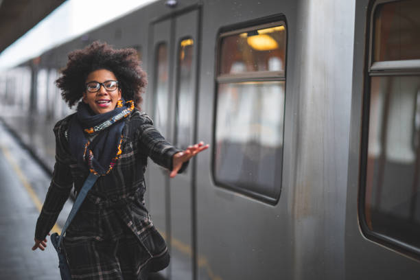 istock Woman running to catch the train 1097725498