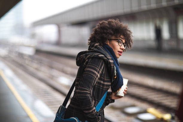 istock Young woman waiting for the train 1097725682