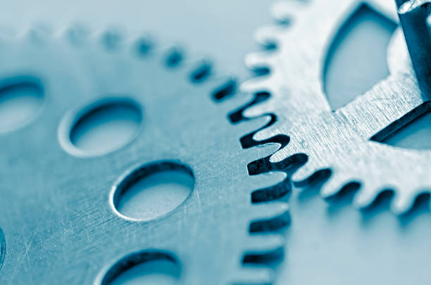 istock Close up on two toothed meshed gears 1097727450