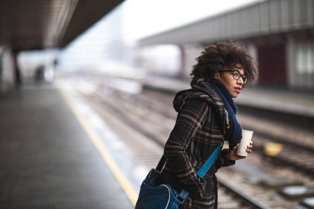 istock Young woman waiting for the train 1097727540