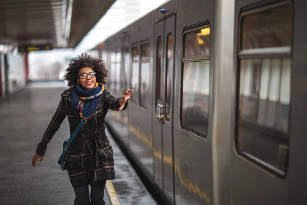 istock Woman running to catch the train 1097727970