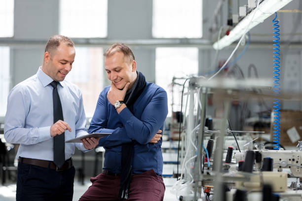 istock Bank manager and factory owner. 1097728488