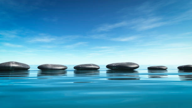 istock step stones in the blue sea 1097728568