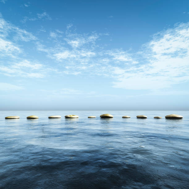 istock step stones in the blue sea 1097728600
