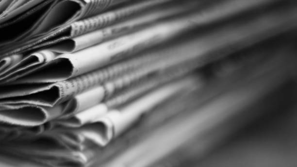 Stack of newspapers Newspapers folded and stacked in a pile. Old journals with news on wooden table. Retro style, blurred background with selective focus, close up article photos stock pictures, royalty-free photos & images