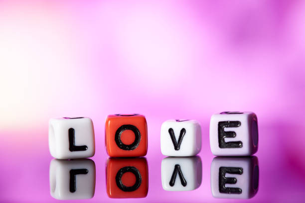 istock Word love  from cubes with reflection on bright blurred background. 1097730408