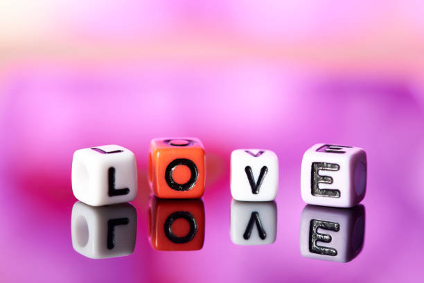 istock Word love  from cubes with reflection on bright blurred background. 1097730414