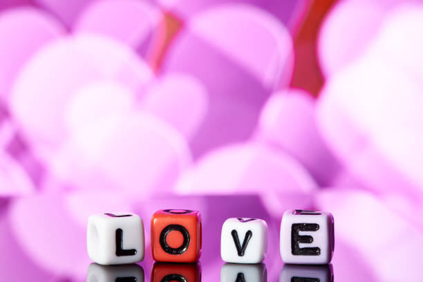 istock Word love  from cubes with reflection on bright blurred background. 1097730422
