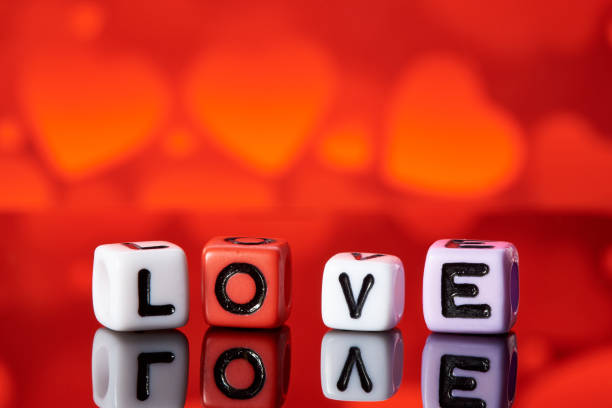 istock Word love  from cubes with reflection on bright blurred background. 1097730468