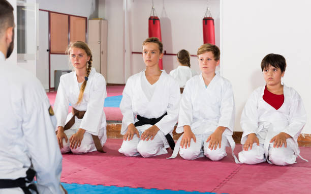 istock Kids taekwondo group ready to practice 1097730824
