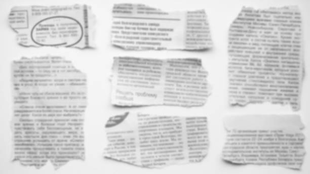 Torn newspapers stock photo