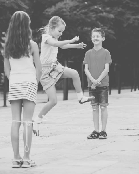 istock Kids playing with chinese jumping rope 1097731172