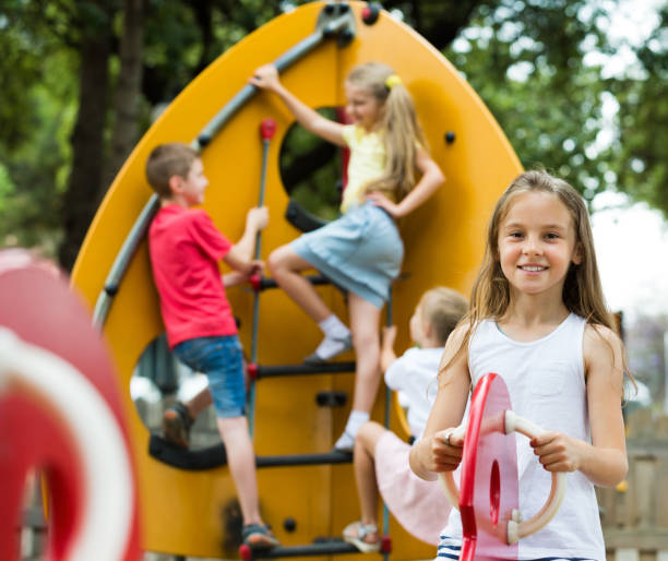 istock Happy girl swinging at playground 1097731196