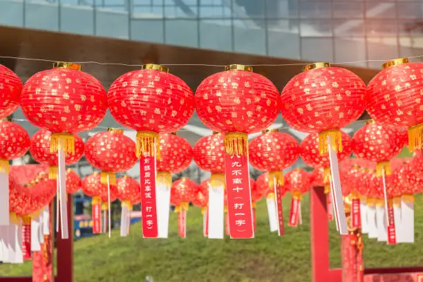 red lanterns with chinese letters printed mean bring good luck,word on paper mean Guessing Lantern Riddles