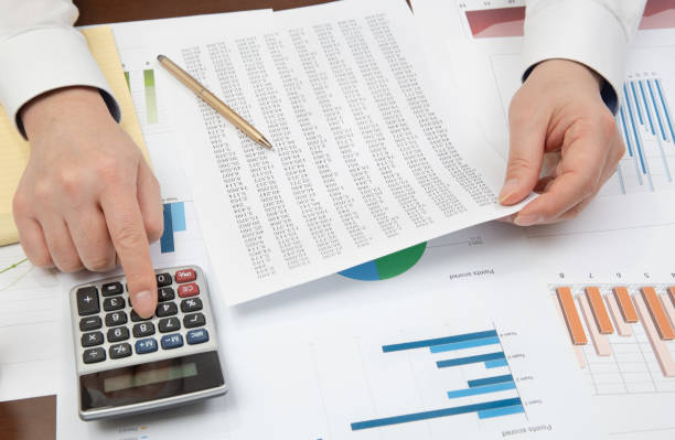 istock Workplace businessman. Contracts, charts, and graphs on the desk. 1097733256