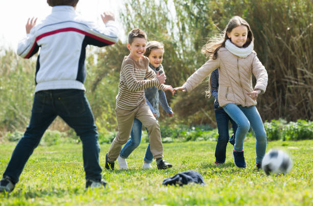 istock children running after ball 1097736236