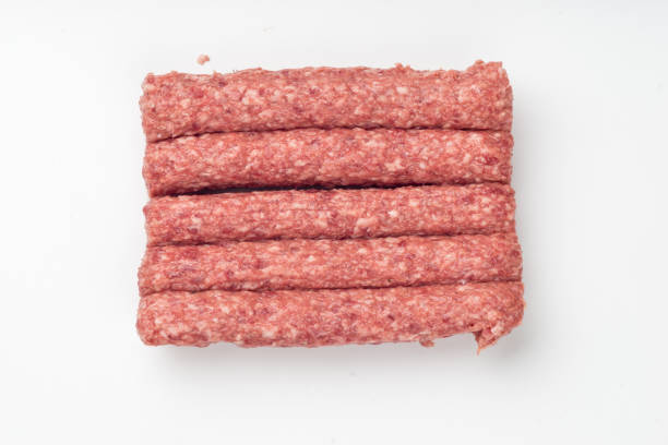 istock Pack of  raw sausages isolated on white 1097736584