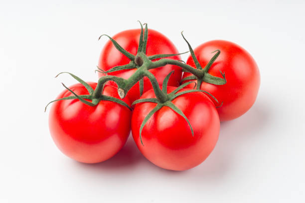 istock Cherry tomato bunch closeup isolated on white background 1097736778