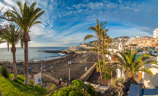 Puerto de Santiago, Tenerife - 10 January, 2019: Landscape with Arena beach and Puerto de Santiago city, Tenerife, Canary island, Spain