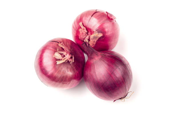 istock Three red onion bulb isolated on white background cutout 1097738096