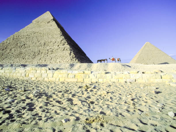 istock Attractions of Egypt. pyramids, camels and ruins. 1097742054