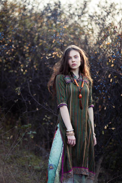 istock Beautiful hippie woman at sunset 1097744450