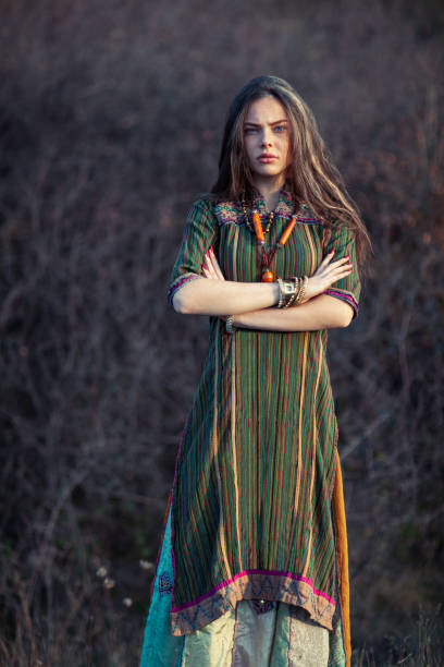 istock Beautiful hippie woman at sunset 1097744460